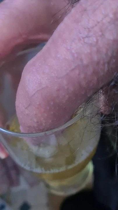Piss in a glass in bathroom.