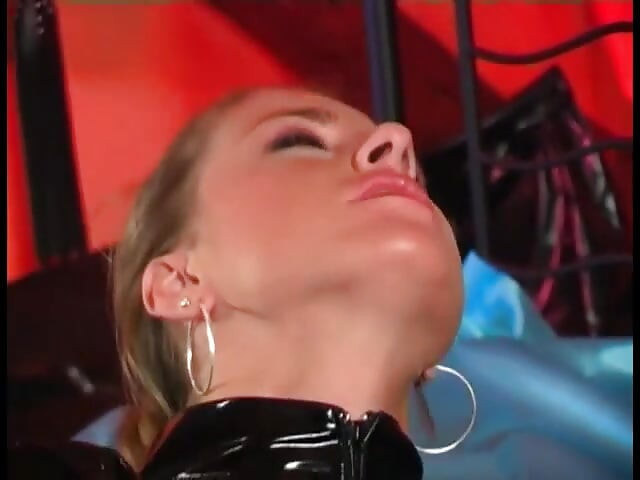 Two latex lesbians love to fuck each other with sex toys