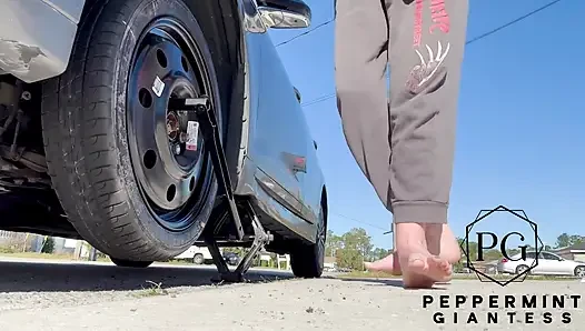 67 Tall Amazon Goddess Changes Her Tire - Big Feet in Frame