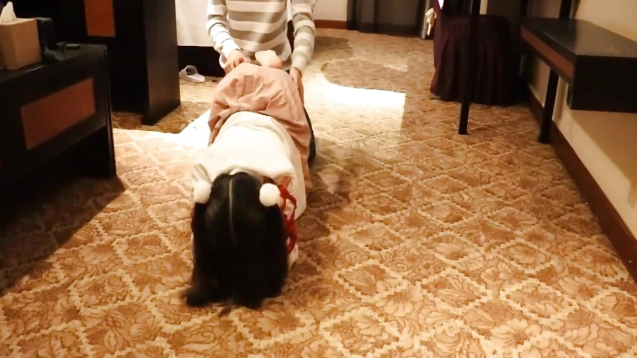 A Cute Little Dressed in a Jk Uniform Was Walking Around Barefoot on the Ground.