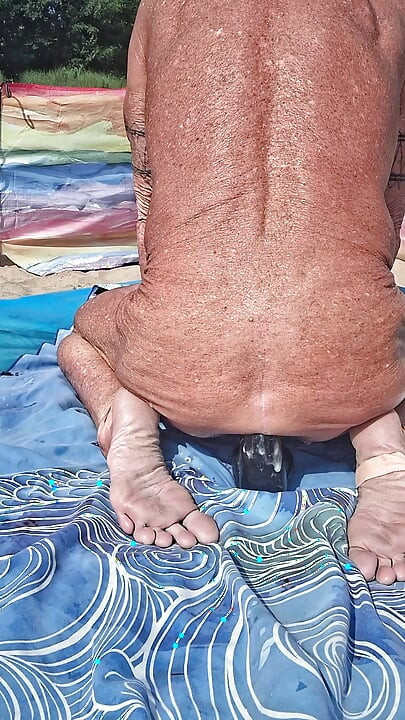 Early morning at the beach stretching of my asshole with my huge black dildo