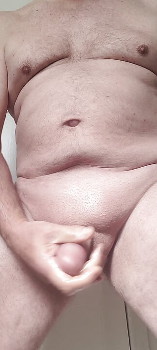 Solosexual strokes my shaved, oiled up cock to get a load of cum to swallow
