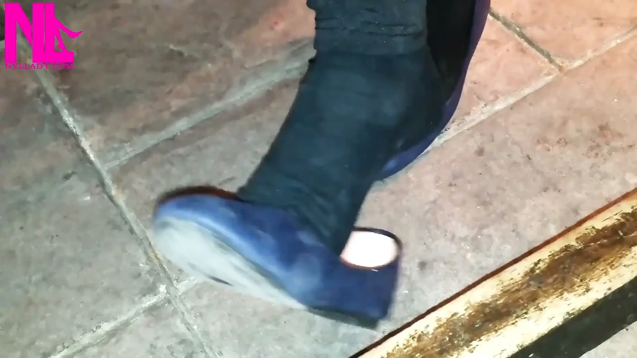 Dangling in Blue Ballet Flats in a Bar