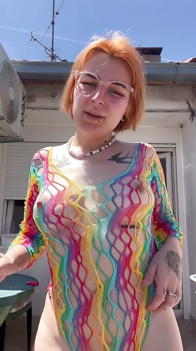 Smoking in a Rainbow Fishnet on the Balcony