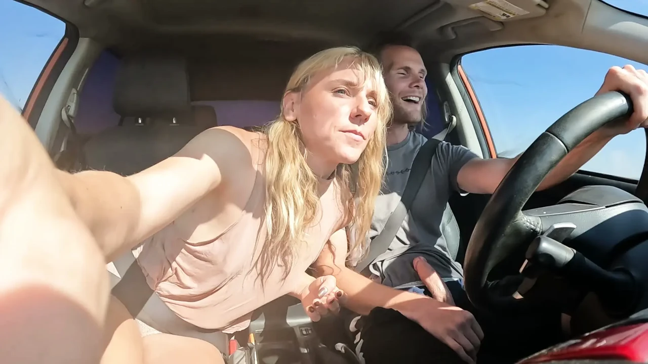 Petite Blonde Gives Her Man Road Head In The Car