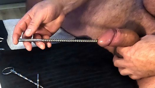 Multiple objects in cock. Extreme urethral sounding + cum. Hard oiled cock stuffed full.