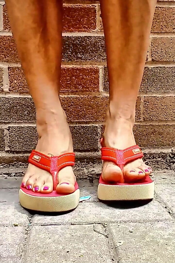 Small Asian Feet in Red Heeled Flip Flops