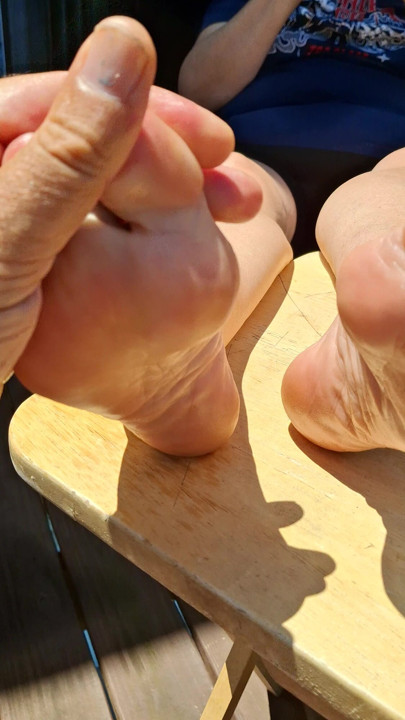 Massaging some oil on her feet before I fuck them