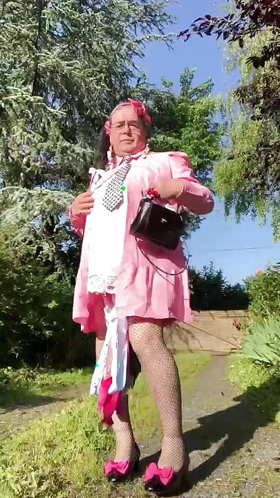 In an outfit with a little pink button dress for an evening.