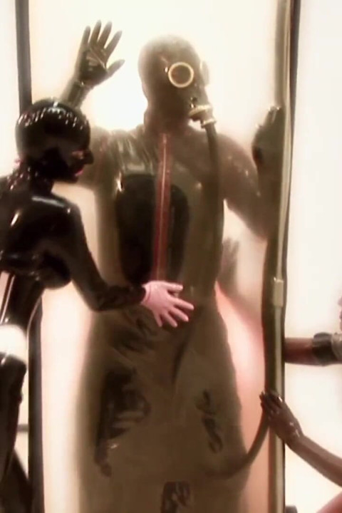 Two masked chicks are having fun with their slave