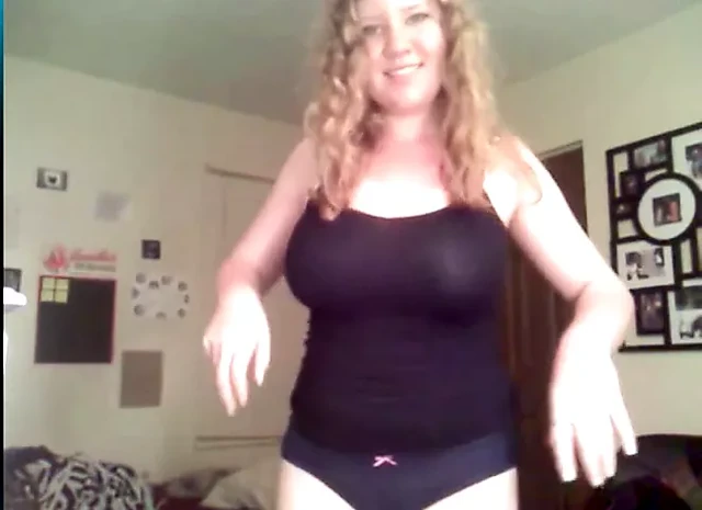 Redhead with big juggs helps herself out with blue dildo