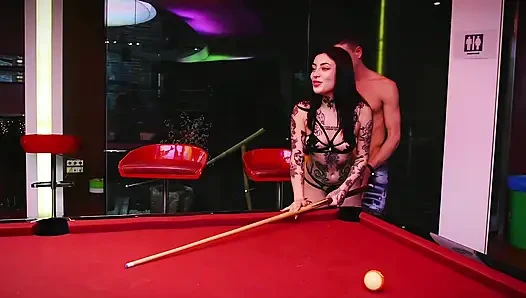 Two horny girls have sex with a stranger on a pool table.