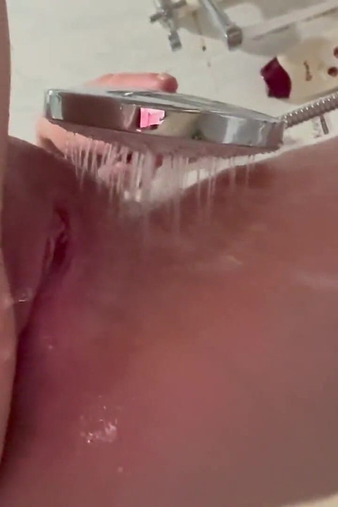 The Redhead Slut Masturbates Her Pussy with the Shower and Enjoys I