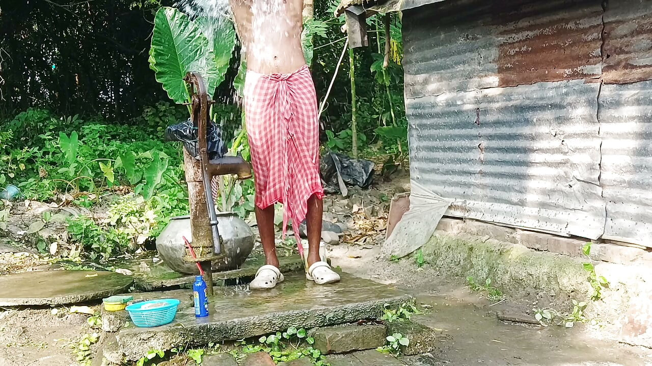 Desi young man bath Open place.