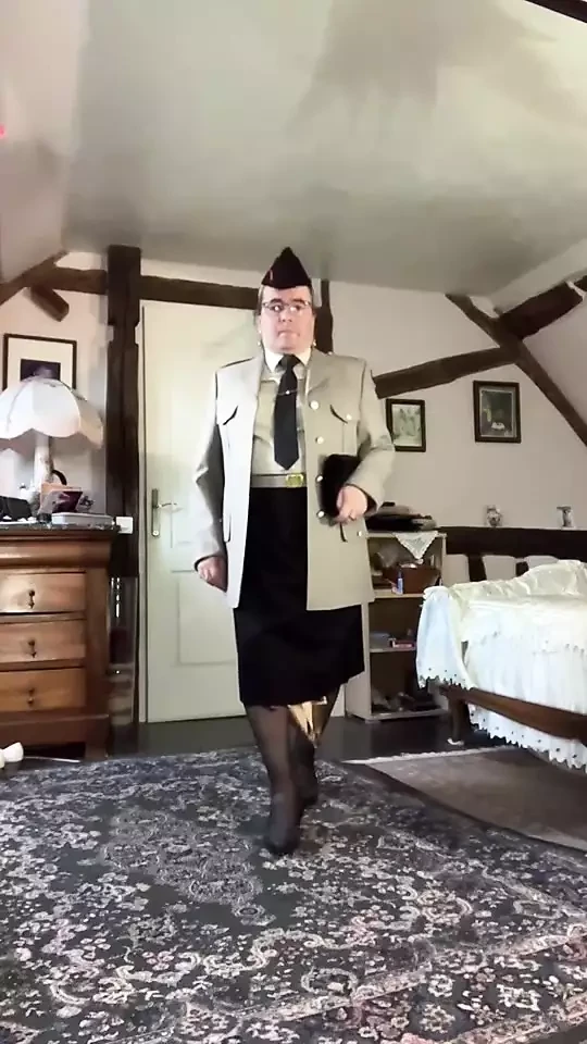 In military uniform with a black tie