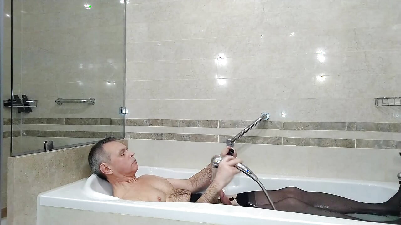 Kinky Mature Guy Masturbates in the Hotel's Room and Bathroom
