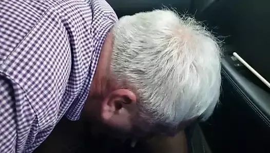 Goaty old man sucking black cock in the car