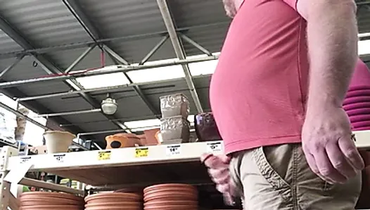 Bear public cum in a hardware store