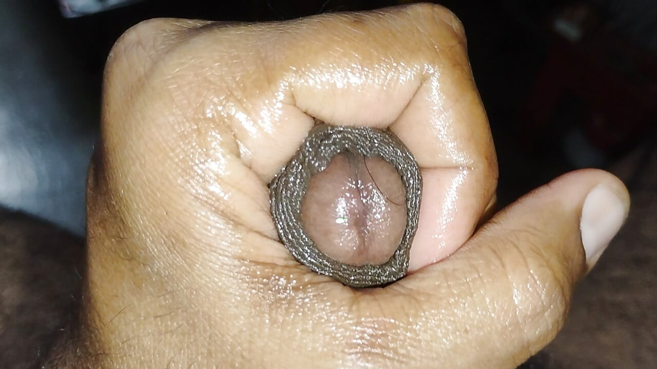 Massage of penis with Ayurvedic oil