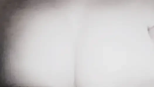 A girl roughly fondles her large breasts