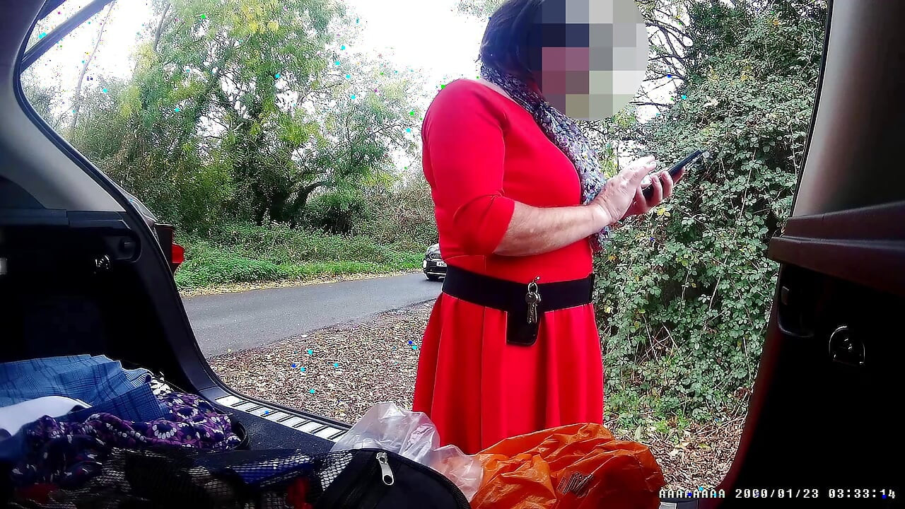Just getting changed parked at side of road with cars driving past