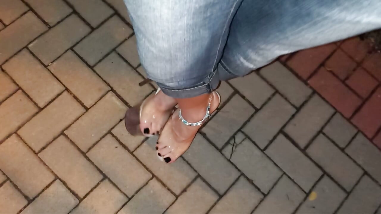 nighttime crossdressing on a public street in 20cm stripper heels, black toes, and black claws