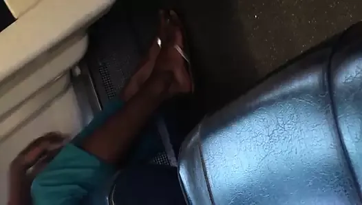 Indian woman barefoot shoe change on train