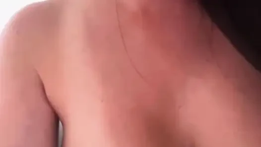 The stepmother is fucking her pussy and shaking her big tits.