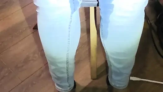 Desperately trying to hold but letting it all out in female light wash jeans