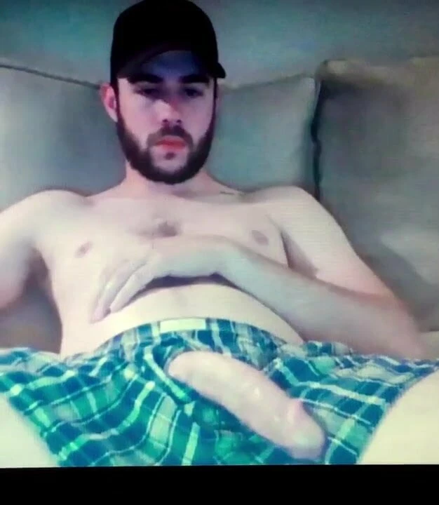 Straight bearded guy shows his massive flaccid cock in short