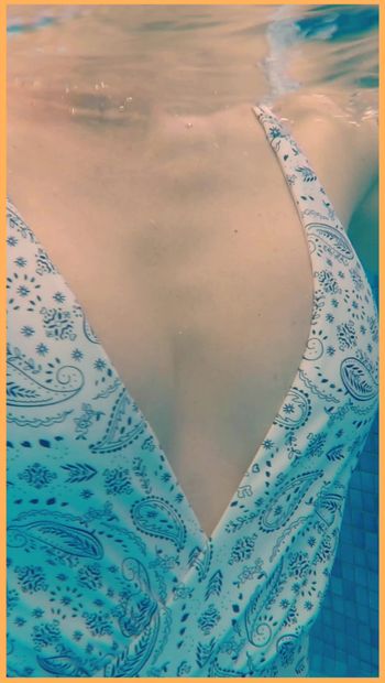 Wife flashes her tits in the hotel pool.