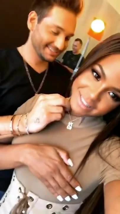 Christina Milian getting her makeup done in see-through top