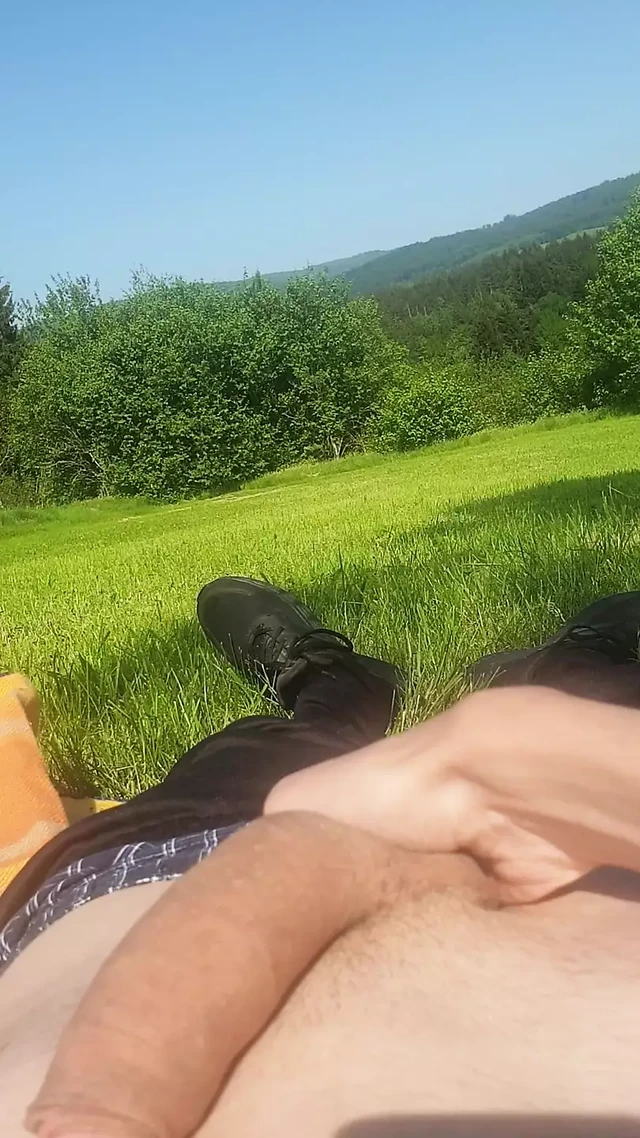 Martin masturbating his semi-rigid cock to cumshot outside
