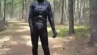 Full leather enclosure wank in public in the woods.