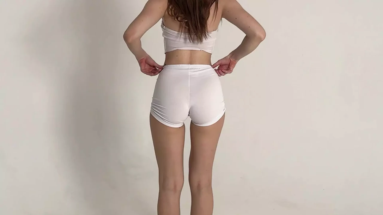 stretching of a beautiful blonde in short shorts