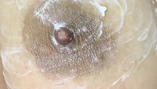 Mom vibrates her big tits with her big vibrator