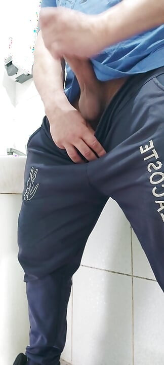 A Well-endowed Brazilian Man Urinating and Showing His Thick Penis to His Female Friends.