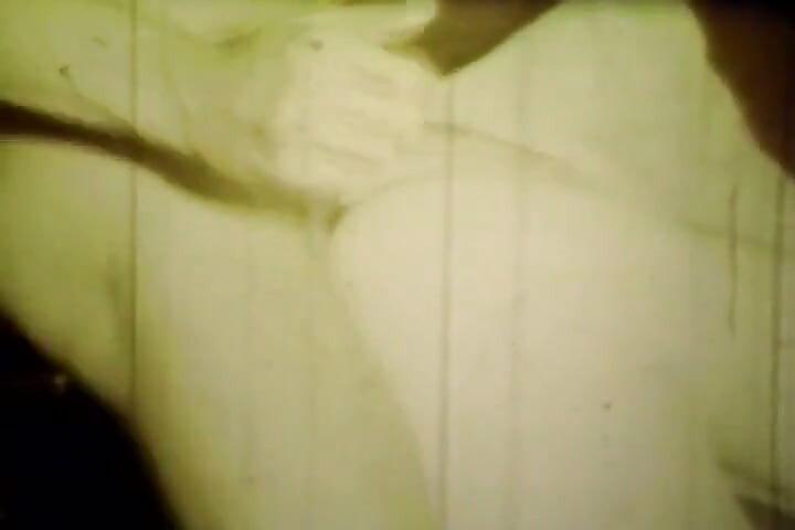 Worn Sepia Loop Captures Curly Retro Couple in Raw Bedroom Passion
