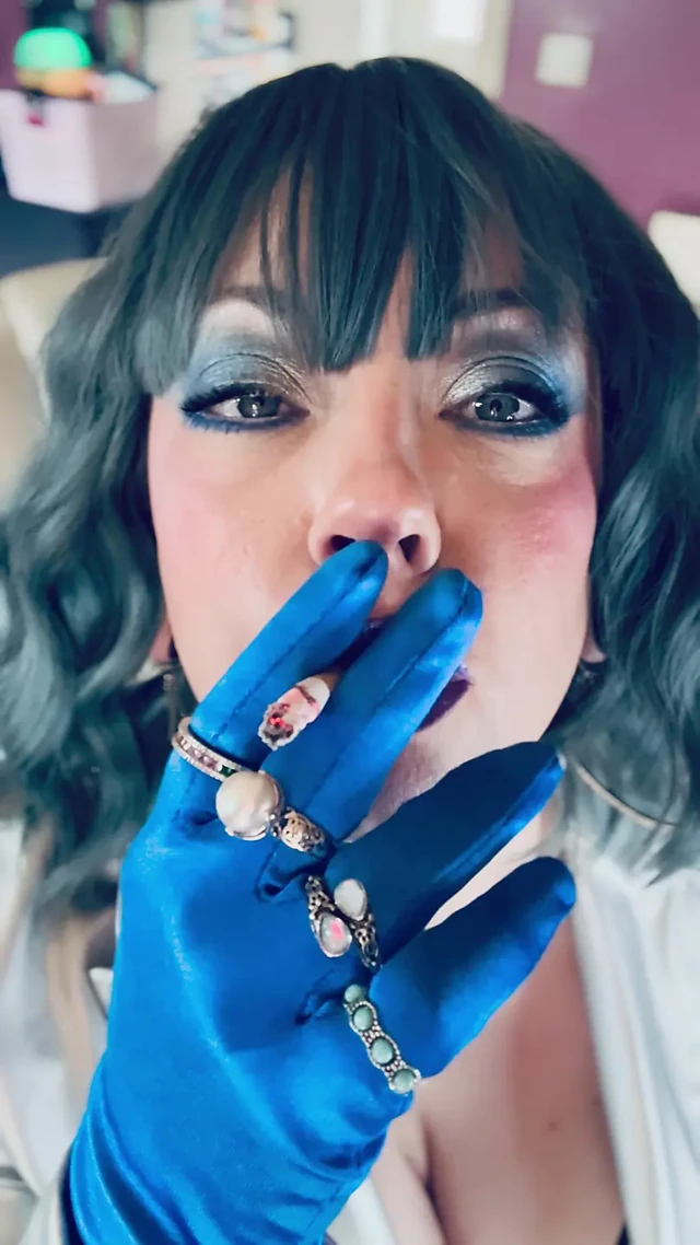 Dressed In Silver & Gloves & Rings Tina Snua Smoke A Supeking Cigarette