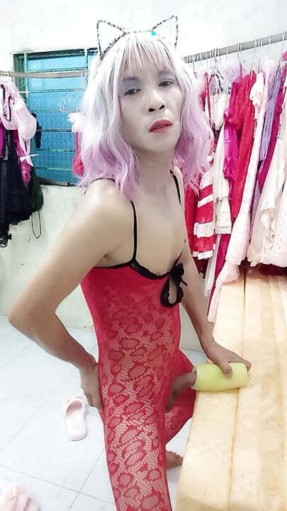 Oanh Le transgender wearing pornographic pantyhose playing with a can of pretense pleasure