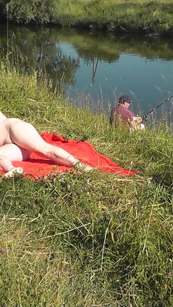 Captivating moment from "Wild beach. Sexy MILF Platinum naked sunbathing on river bank, random fisherman guy watches. Naked"