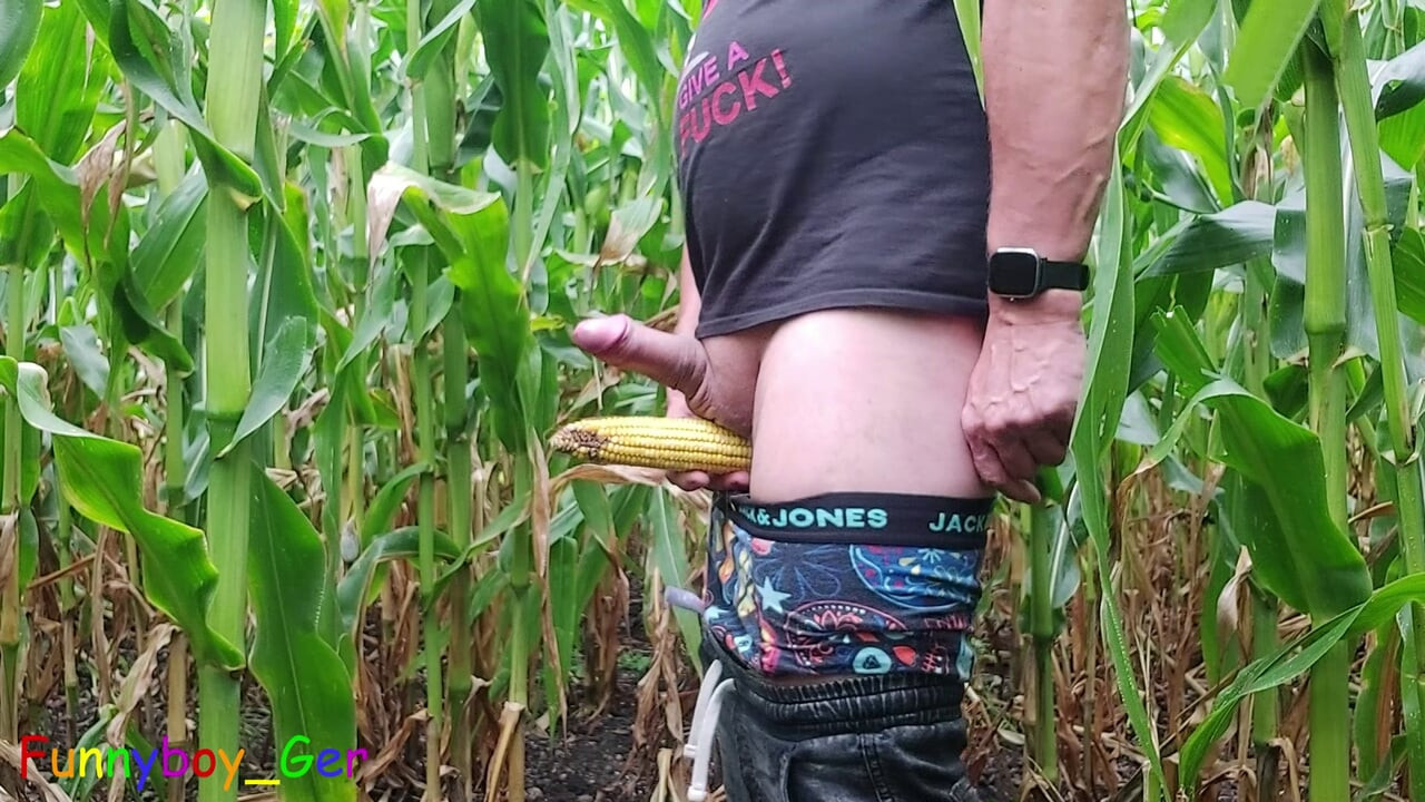 A sexy guy pisses in a cornfield, jerks off his thick cock and engages in other kinky play.