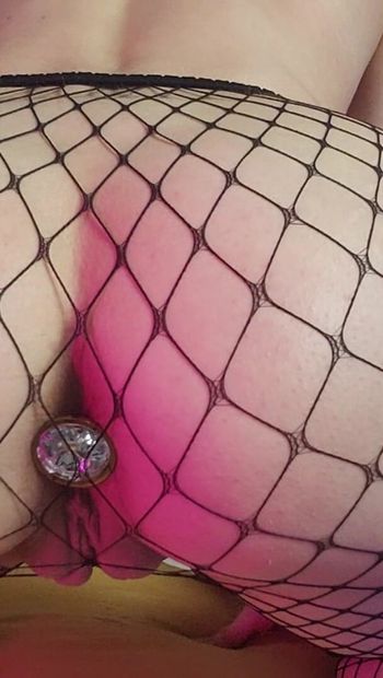 Playing with my buttplug in fishnets