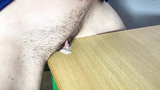 The friction of a petite teen solo, experienced an orgasm from friction and flowed onto the table