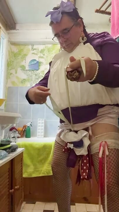 Dressed in a bubble skirt to pee into a bottle
