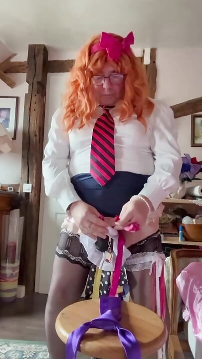 In outfit with a navy blue skirt to ejaculate on the purple tie