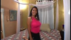 Busty ethnic chick fucks a white cock on home video