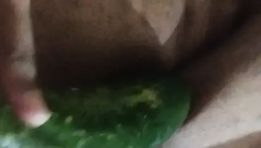 Busty bitch playing with herself and fucking herself with a cucumber