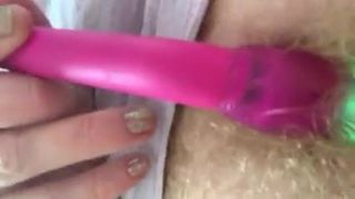 Wife plays with vibrator in her hairy pussy