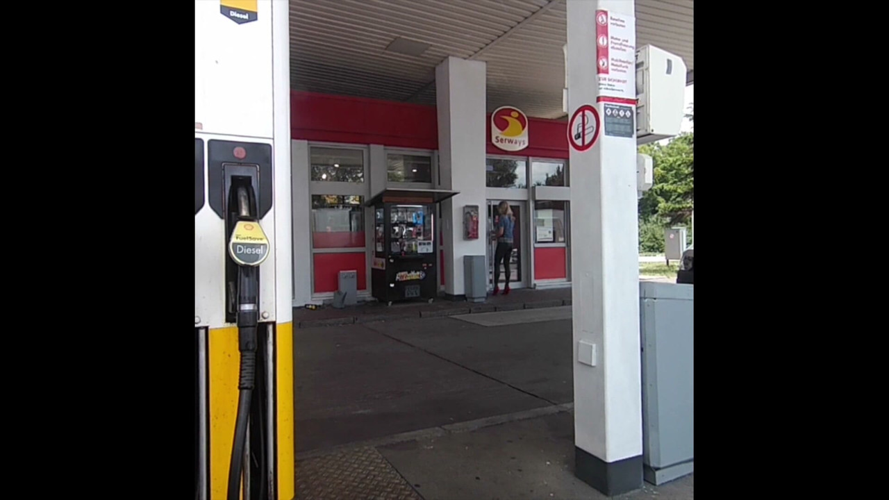 At the gas station with visible suspenders